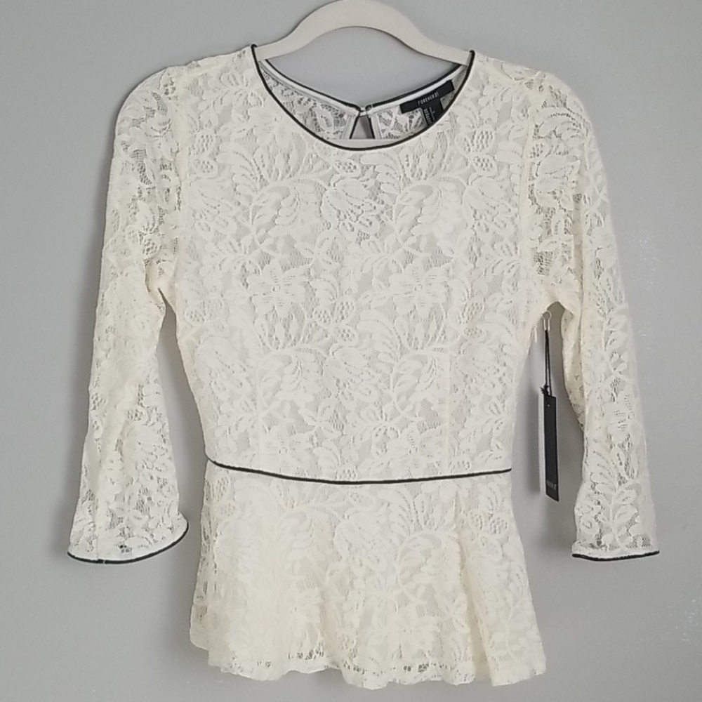 Lace peplum top with leather edging & keyhole back